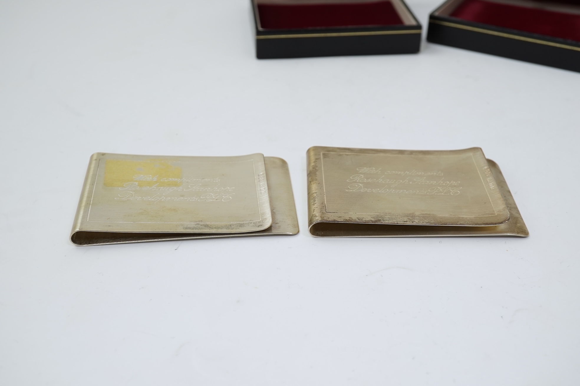 A pair of Elizabeth II silver money clips by Adrian Gerald Benney